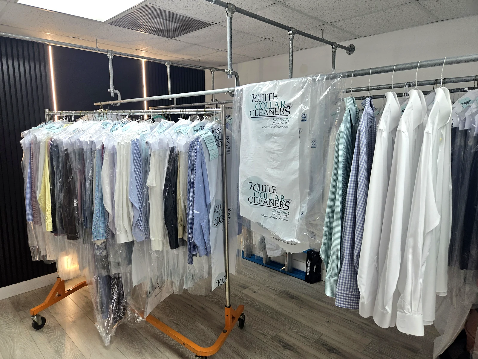 Dry cleaning garments on a rack